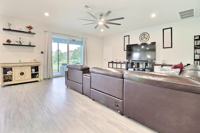 living room with recessed lighting, a ceiling fan, light wood-type flooring, and visible vents
