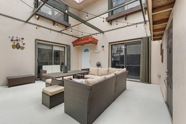 view of patio / terrace with outdoor dining space and an outdoor living space