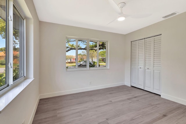 2410 SW 1st St, Boynton Beach, FL 33435 - unfurnished bedroom featuring baseboards, light wood-style floors, and visible vents