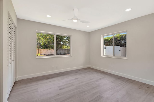 2410 SW 1st St, Boynton Beach, FL 33435 - unfurnished bedroom featuring baseboards, recessed lighting, and wood finished floors