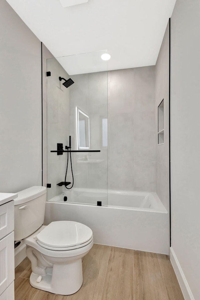 2410 SW 1st St, Boynton Beach, FL 33435 - full bath with vanity, toilet, washtub / shower combination, and wood finished floors