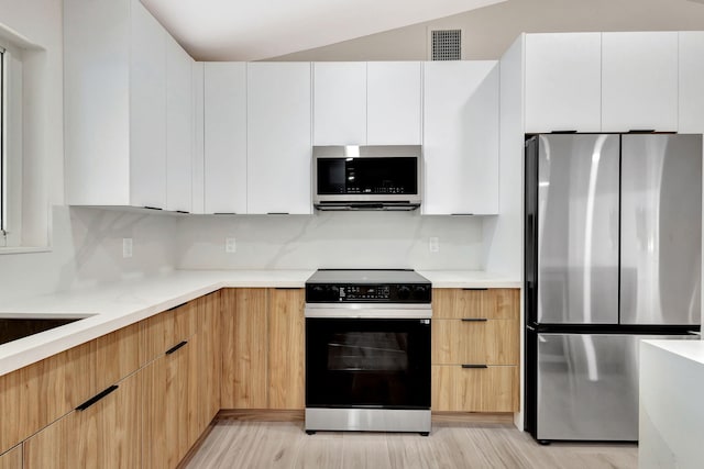 2410 SW 1st St, Boynton Beach, FL 33435 - kitchen featuring modern cabinets, light countertops, and stainless steel appliances