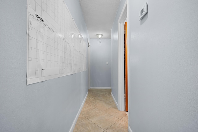 115 NE Caprona Ave, Port Saint Lucie, FL 34983 - corridor with light tile patterned floors and baseboards