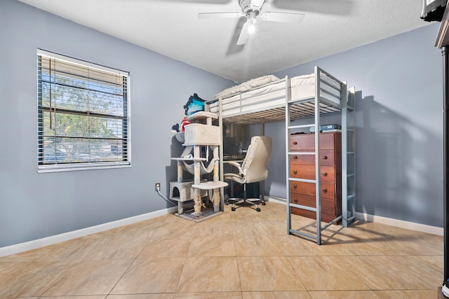 115 NE Caprona Ave, Port Saint Lucie, FL 34983 - bedroom featuring tile patterned flooring, baseboards, and ceiling fan