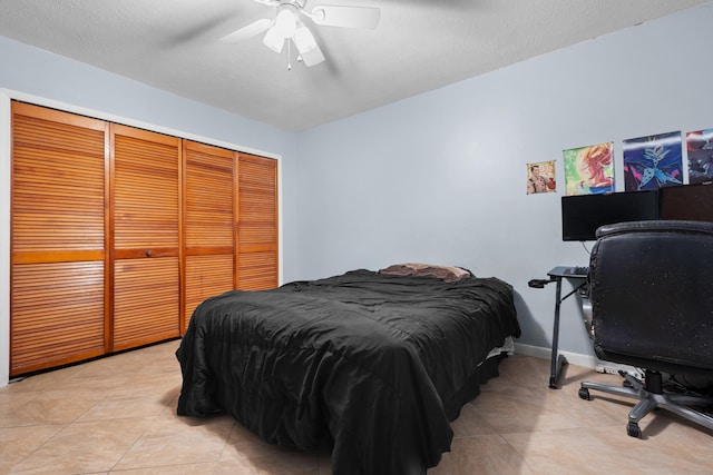 115 NE Caprona Ave, Port Saint Lucie, FL 34983 - bedroom featuring ceiling fan, a closet, and light tile patterned floors