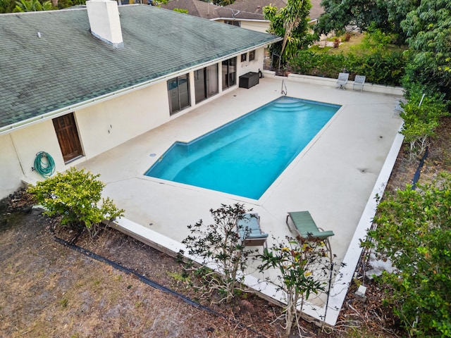 115 NE Caprona Ave, Port Saint Lucie, FL 34983 - outdoor pool with a patio area