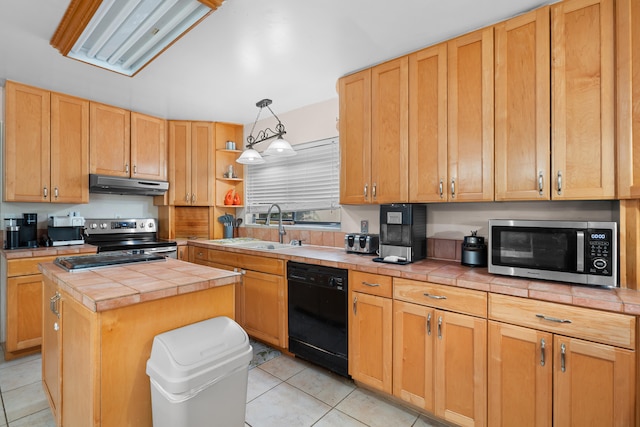 115 NE Caprona Ave, Port Saint Lucie, FL 34983 - kitchen with under cabinet range hood, a sink, tile counters, and appliances with stainless steel finishes