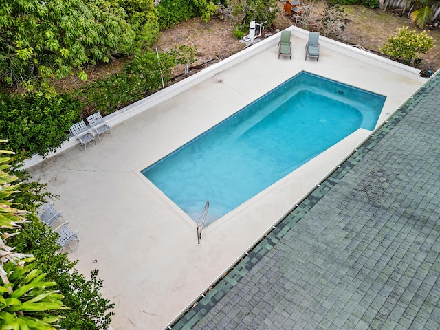 115 NE Caprona Ave, Port Saint Lucie, FL 34983 - view of swimming pool with a patio area