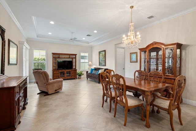 10145 SW Canossa Way, Port Saint Lucie, FL 34986 - dining area featuring visible vents, crown molding, a raised ceiling, and ceiling fan with notable chandelier