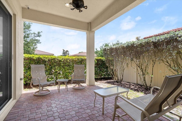 10145 SW Canossa Way, Port Saint Lucie, FL 34986 - view of patio / terrace with a fenced backyard