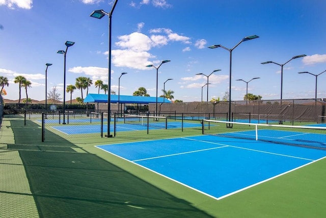 10145 SW Canossa Way, Port Saint Lucie, FL 34986 - view of sport court featuring fence