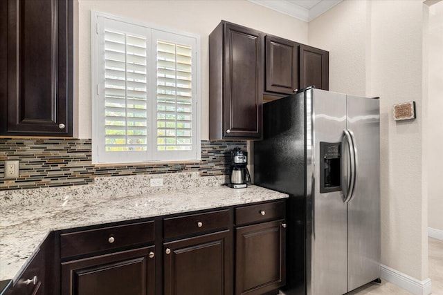 10145 SW Canossa Way, Port Saint Lucie, FL 34986 - kitchen featuring tasteful backsplash, stainless steel refrigerator with ice dispenser, and dark brown cabinets