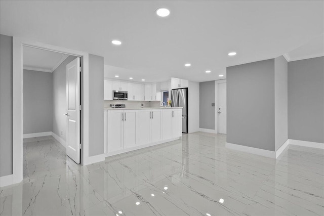 3040 Lake Shore Dr Unit 101, Riviera Beach, FL 33404 - kitchen with stainless steel appliances, baseboards, ornamental molding, light marble finish floors, and recessed lighting