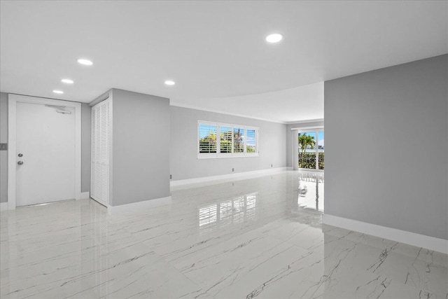 3040 Lake Shore Dr Unit 101, Riviera Beach, FL 33404 - unfurnished room featuring baseboards, recessed lighting, and light marble finish floors