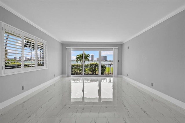 3040 Lake Shore Dr Unit 101, Riviera Beach, FL 33404 - empty room with marble finish flooring, baseboards, and crown molding
