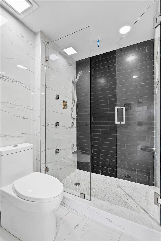 3040 Lake Shore Dr Unit 101, Riviera Beach, FL 33404 - full bathroom featuring toilet, marble look tile flooring, and a shower stall