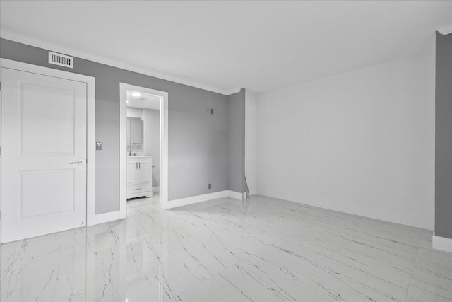3040 Lake Shore Dr Unit 101, Riviera Beach, FL 33404 - unfurnished room featuring baseboards, light marble finish floors, and ornamental molding