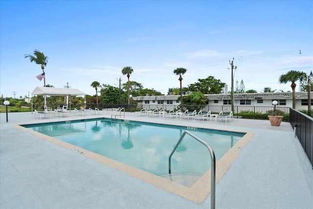 3040 Lake Shore Dr Unit 101, Riviera Beach, FL 33404 - community pool featuring a patio