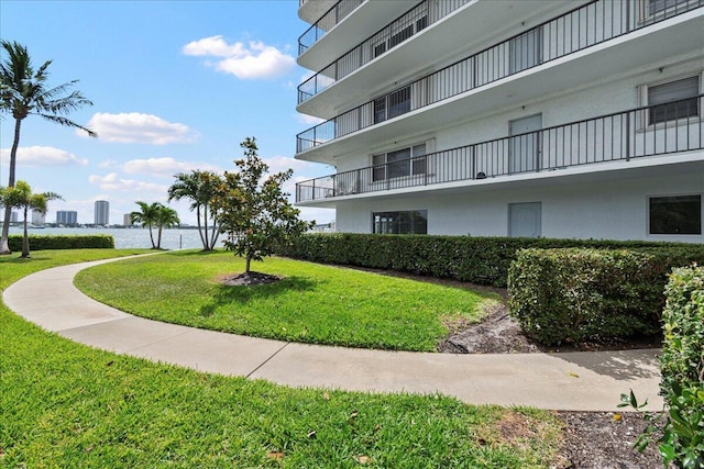 3040 Lake Shore Dr Unit 101, Riviera Beach, FL 33404 - surrounding community with a yard