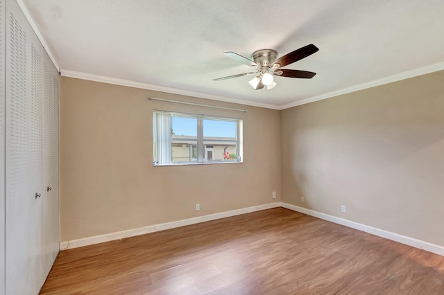 2867 Ashley Dr W Unit G, West Palm Beach, FL 33415 - unfurnished room featuring baseboards, ornamental molding, a ceiling fan, and wood finished floors