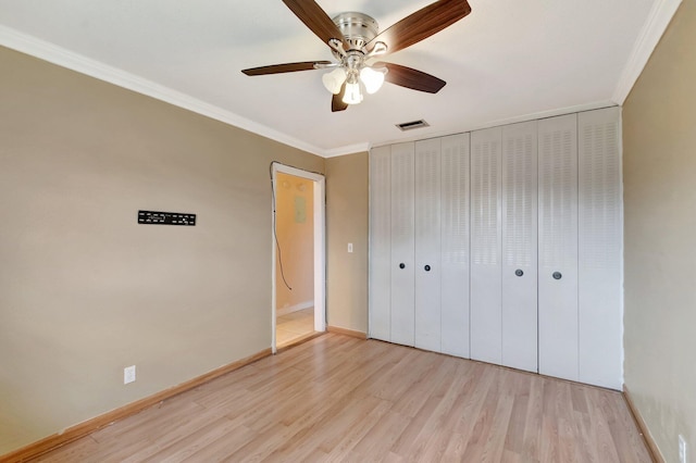 2867 Ashley Dr W Unit G, West Palm Beach, FL 33415 - unfurnished bedroom with visible vents, light wood finished floors, crown molding, and baseboards