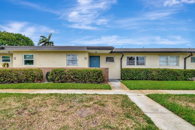 2867 Ashley Dr W Unit G, West Palm Beach, FL 33415 - single story home featuring a front lawn and stucco siding