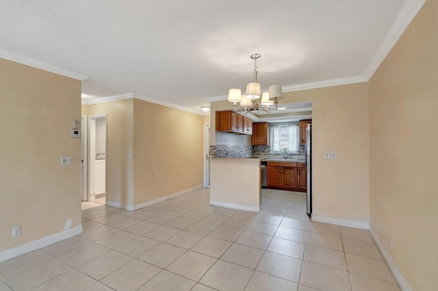 2867 Ashley Dr W Unit G, West Palm Beach, FL 33415 - kitchen featuring crown molding, brown cabinets, light countertops, an inviting chandelier, and light tile patterned flooring