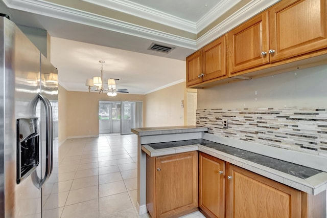 2867 Ashley Dr W Unit G, West Palm Beach, FL 33415 - kitchen featuring crown molding, stainless steel refrigerator with ice dispenser, visible vents, and a chandelier