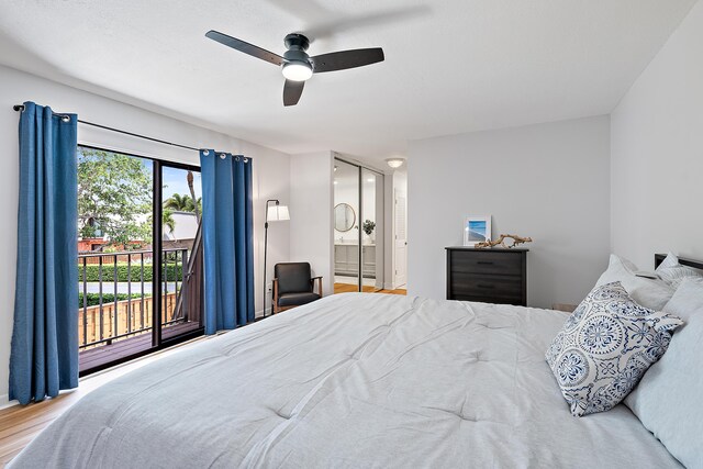 1420 Ocean Way Unit 30C, Jupiter, FL 33477 - bedroom with access to outside, ensuite bathroom, wood finished floors, and a ceiling fan
