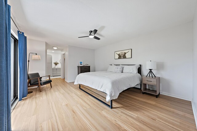 1420 Ocean Way Unit 30C, Jupiter, FL 33477 - bedroom featuring light wood-type flooring, baseboards, a ceiling fan, and connected bathroom