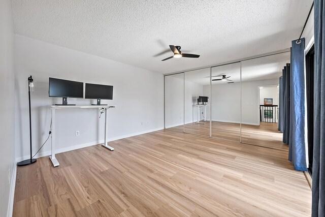 1420 Ocean Way Unit 30C, Jupiter, FL 33477 - unfurnished living room featuring ceiling fan, light wood-style floors, a textured ceiling, and baseboards
