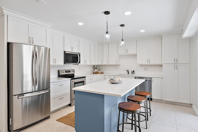 1420 Ocean Way Unit 30C, Jupiter, FL 33477 - kitchen featuring stainless steel appliances, light tile patterned floors, a sink, a kitchen island, and recessed lighting