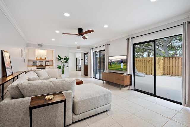1420 Ocean Way Unit 30C, Jupiter, FL 33477 - living room featuring ornamental molding, light tile patterned floors, healthy amount of natural light, recessed lighting, and a ceiling fan