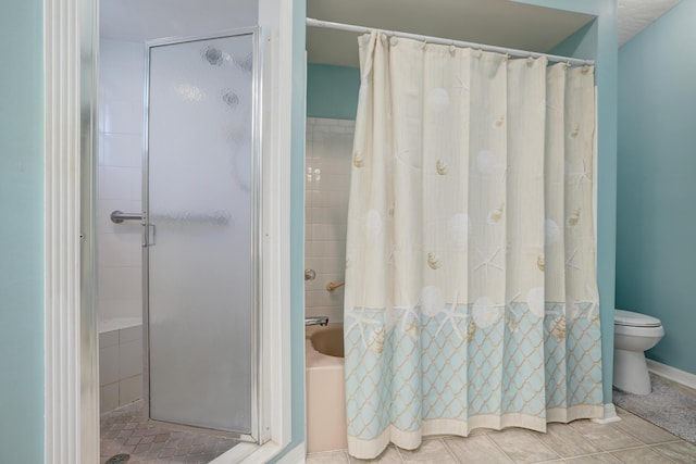 bathroom featuring toilet and tile patterned flooring