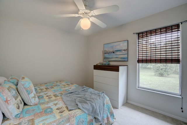bedroom featuring carpet floors, a ceiling fan, and baseboards