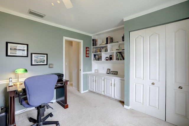 office with visible vents, ornamental molding, baseboards, and light colored carpet