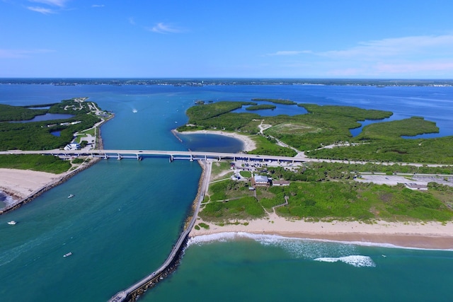 bird's eye view featuring a water view and a beach view