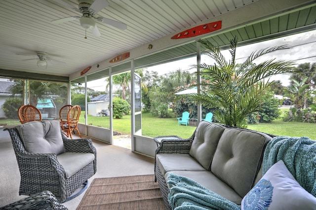sunroom featuring ceiling fan and outdoor lounge area