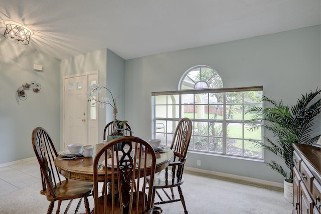 dining area featuring baseboards and a healthy amount of sunlight