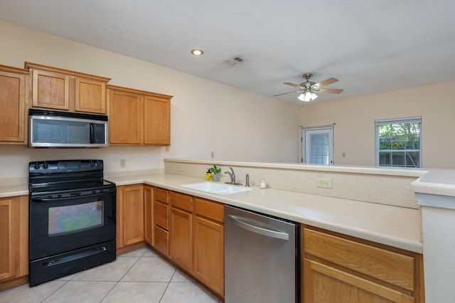 647 Gap Creek Dr, Fort Walton Beach, FL 32548 - kitchen with stainless steel appliances, a sink, light tile patterned floors, light countertops, and ceiling fan