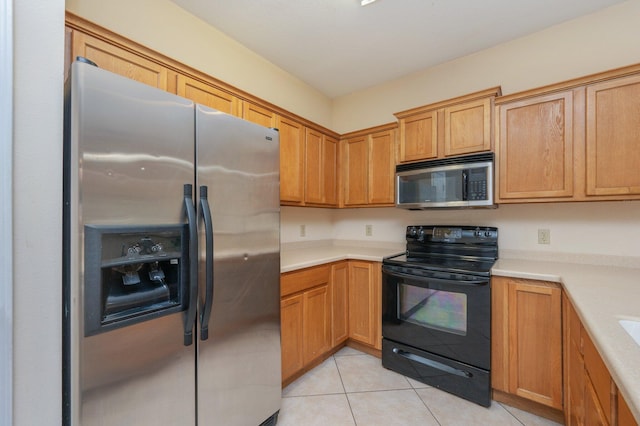 647 Gap Creek Dr, Fort Walton Beach, FL 32548 - kitchen featuring appliances with stainless steel finishes, light countertops, and light tile patterned floors