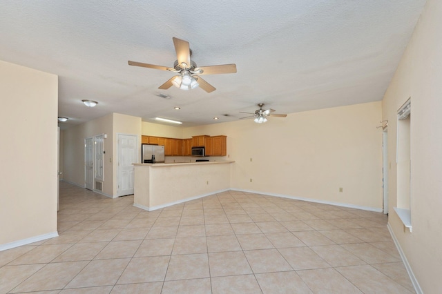 647 Gap Creek Dr, Fort Walton Beach, FL 32548 - unfurnished living room featuring a ceiling fan, light tile patterned floors, and baseboards