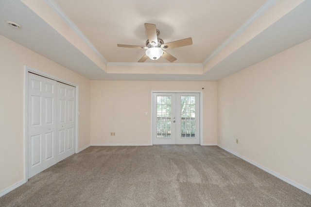 647 Gap Creek Dr, Fort Walton Beach, FL 32548 - unfurnished bedroom with a raised ceiling, french doors, carpet floors, ornamental molding, and baseboards
