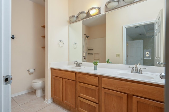 647 Gap Creek Dr, Fort Walton Beach, FL 32548 - full bath with toilet, tile patterned floors, double vanity, a shower, and baseboards