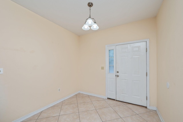 647 Gap Creek Dr, Fort Walton Beach, FL 32548 - entryway with baseboards, light tile patterned flooring, and a chandelier