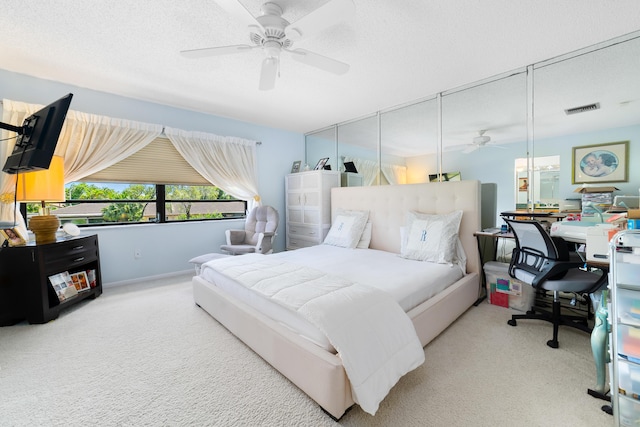 bedroom with carpet and a ceiling fan