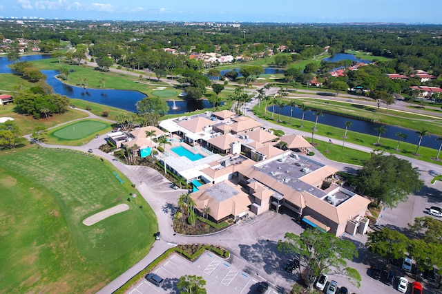 aerial overview of property's location featuring a nearby body of water and a local golf course