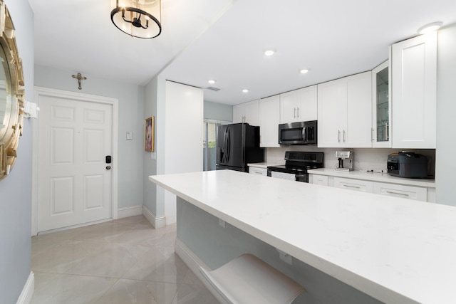 kitchen featuring stainless steel appliances, baseboards, light marble finish flooring, glass insert cabinets, and white cabinets