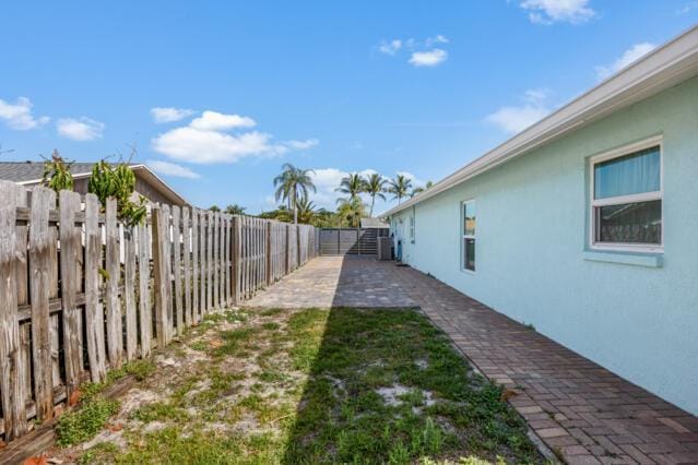 view of yard with a fenced backyard and a patio