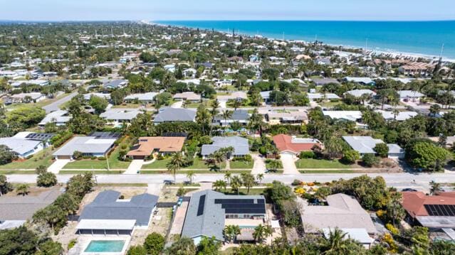 drone / aerial view featuring a water view and a residential view